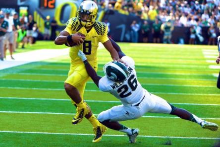 The Spartans led at one point in last year's MSU/Oregon game in Eugene, OR. Then...Mariota. Steve Dykes -- Getty